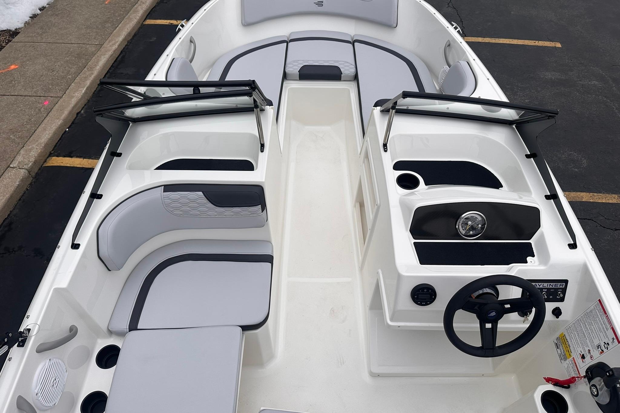 2026 Bayliner M17 boat interior with modern seating and steering console.