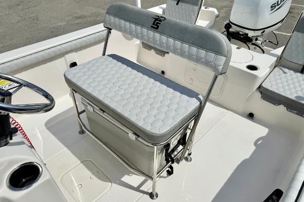 2025 Carolina Skiff 21 LS boat interior with cushioned seating and storage.