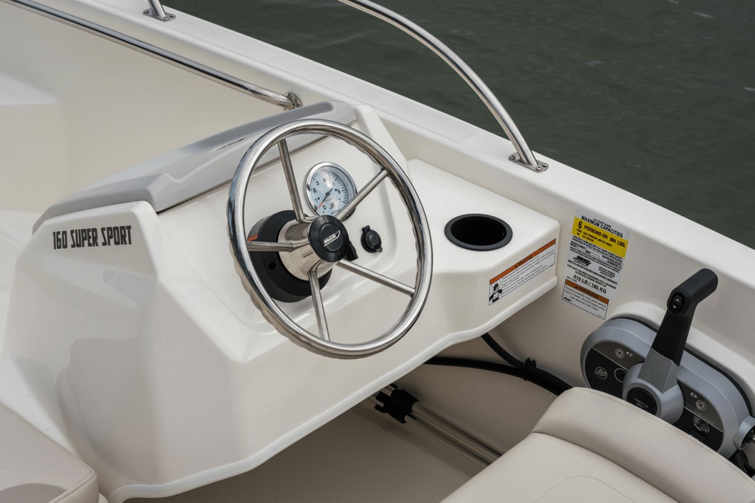 The image shows the helm of a Boston Whaler 160 Super Sport boat.