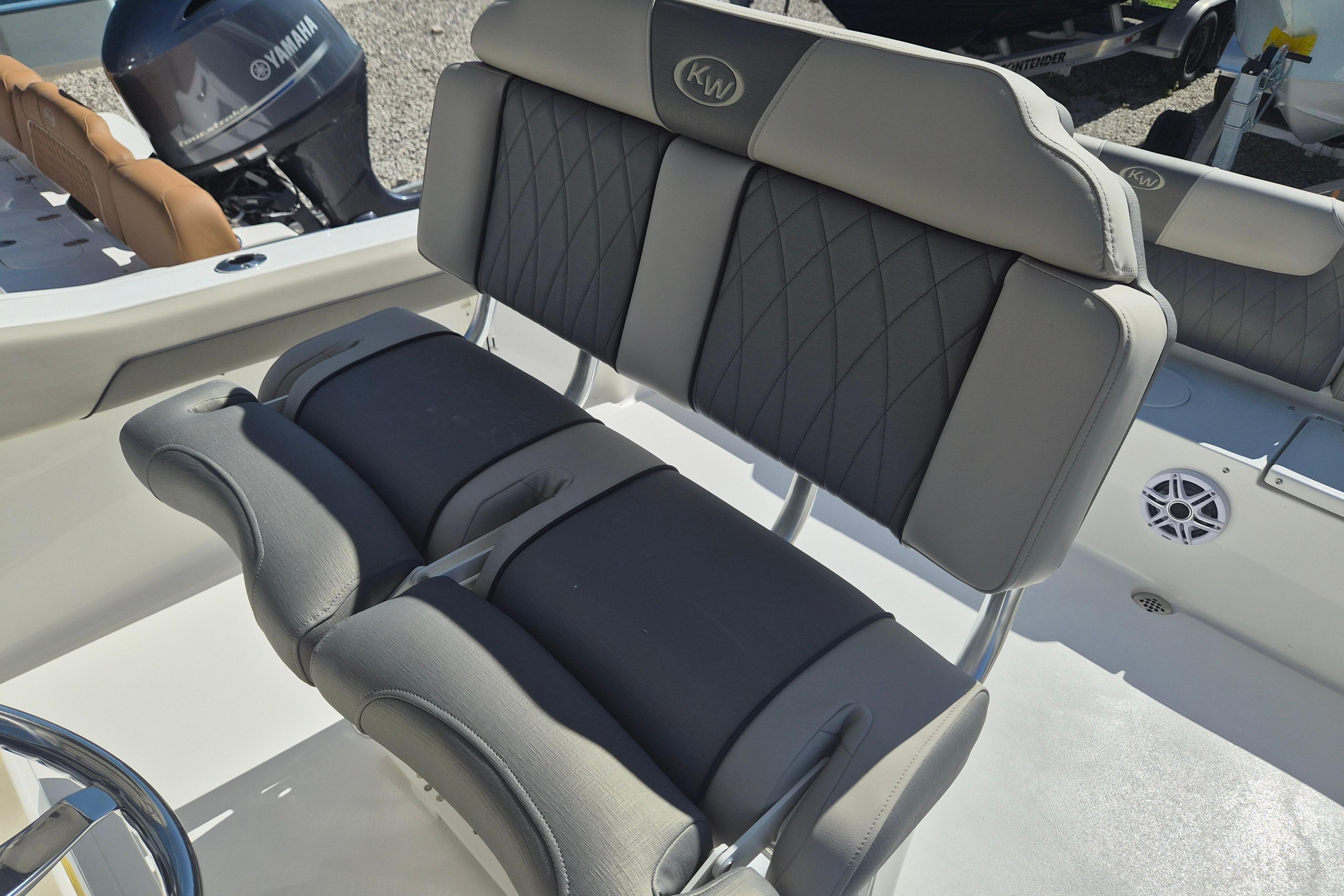 2026 Key West 239 FS boat interior with cushioned seating and Yamaha engine.