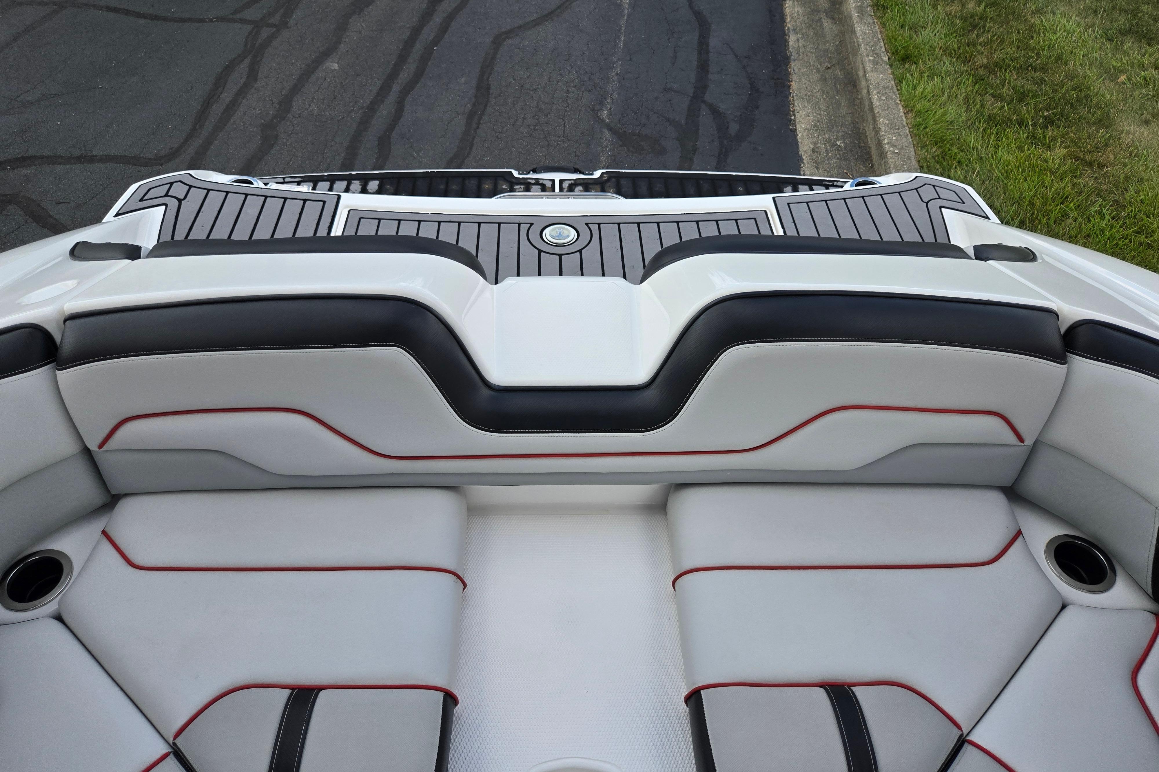 2018 Yamaha Boats 212X interior seating with sleek design and red accents.