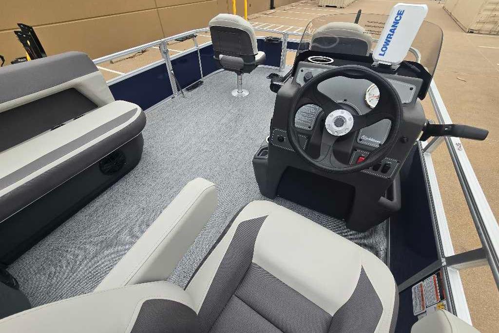 2026 Sun Tracker Bass Buggy 16 XL Select interior with steering console and seating.