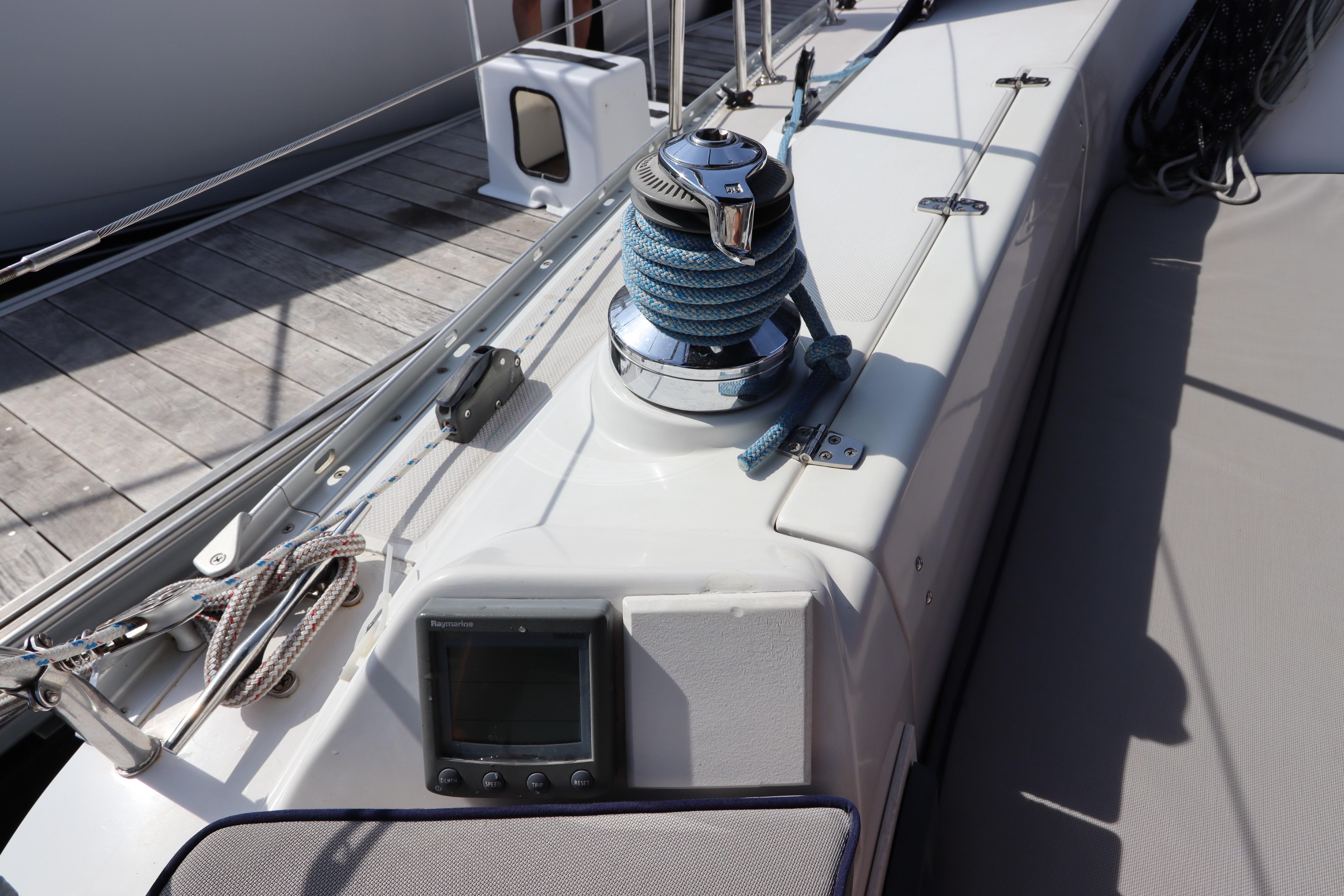 Deck of 2011 Catalina 355 sailboat with winch and navigation display.