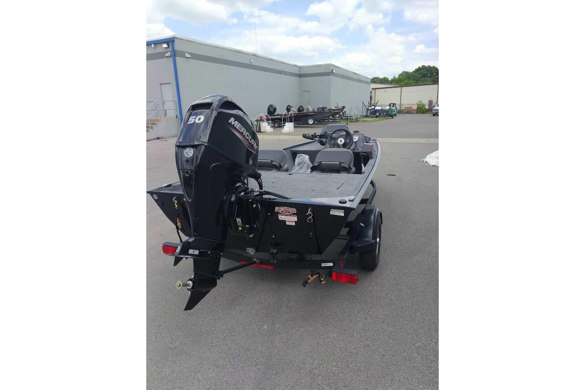 2026 Tracker Bass Tracker Classic XL boat with Mercury 50 engine, parked outdoors.