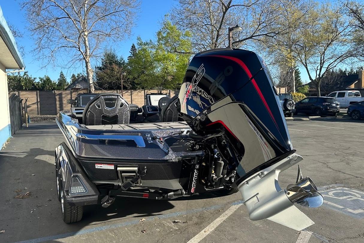 2026 Ranger Z521R Garmin Cup-Equipped boat with powerful outboard motor in parking lot.