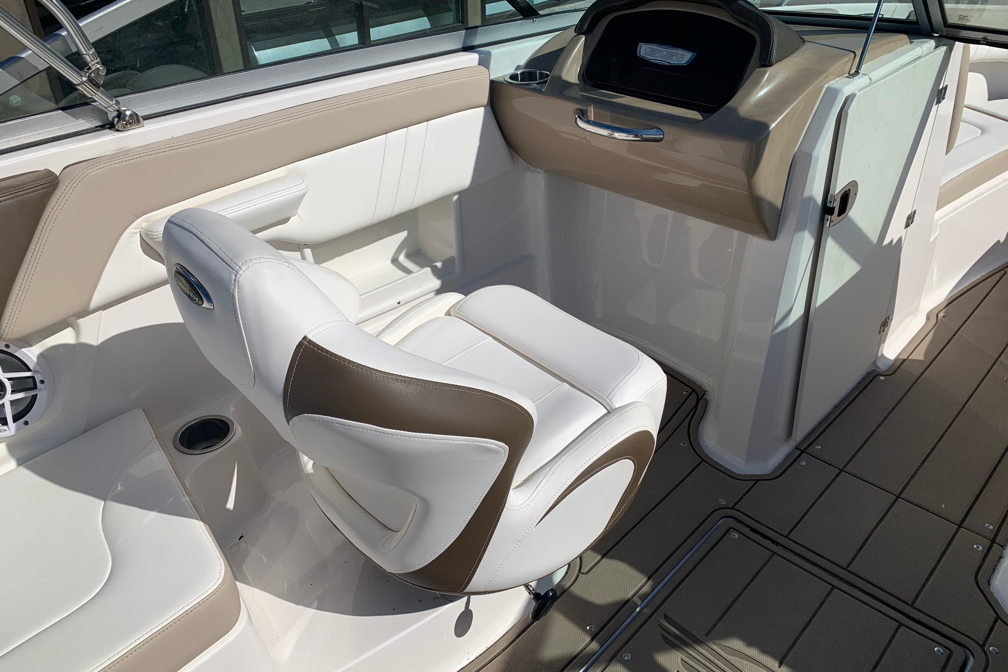 Interior of 2022 Chaparral 23 SSi boat with white and tan seating.