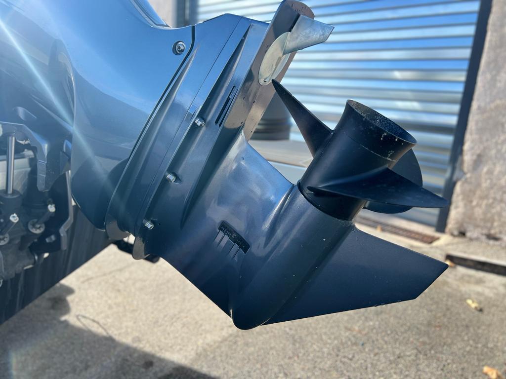 Close-up of a 2023 Capelli Tempest 700 boat propeller in sunlight.