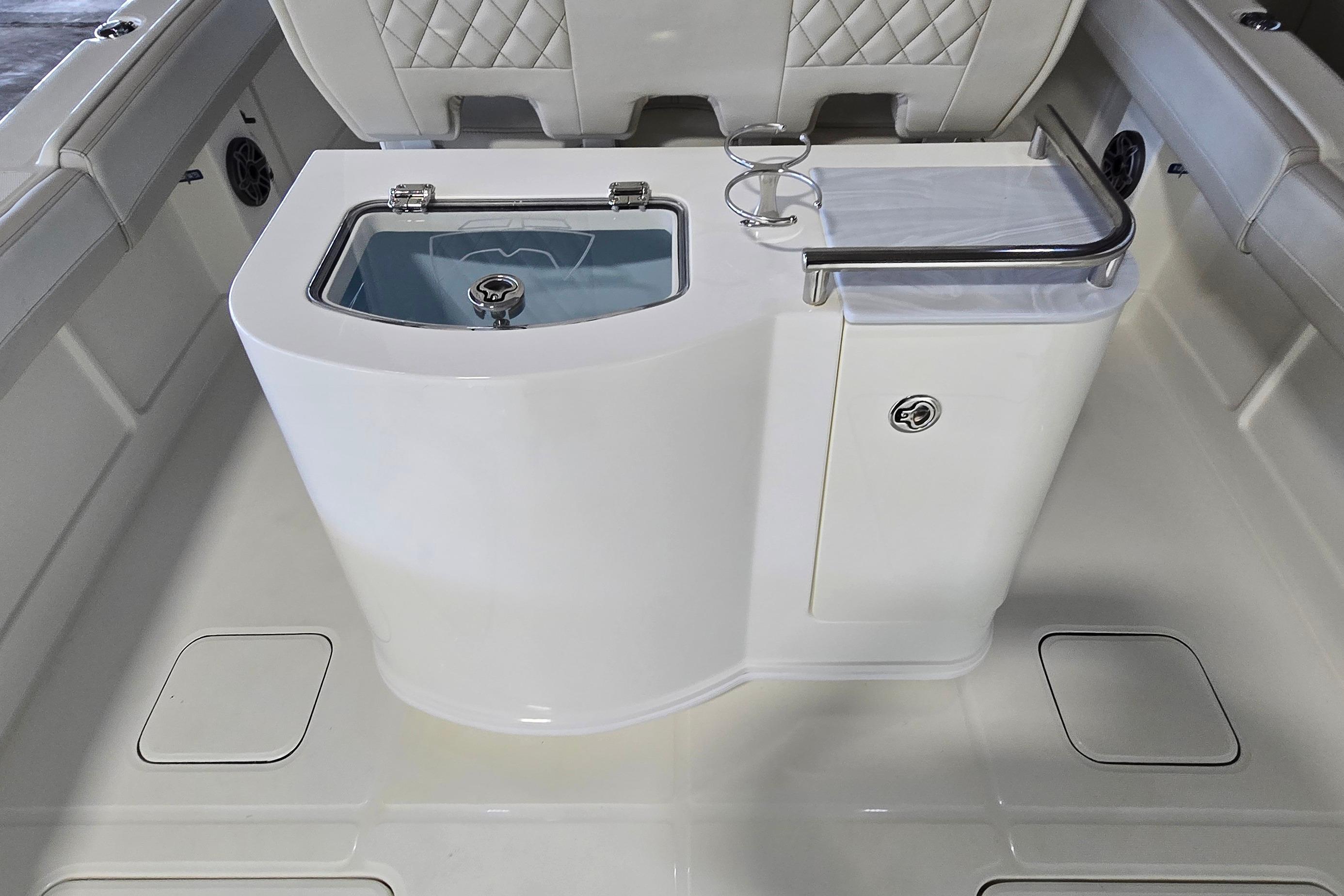 2024 WorldCat 280 CC-X boat interior with seating and storage features.