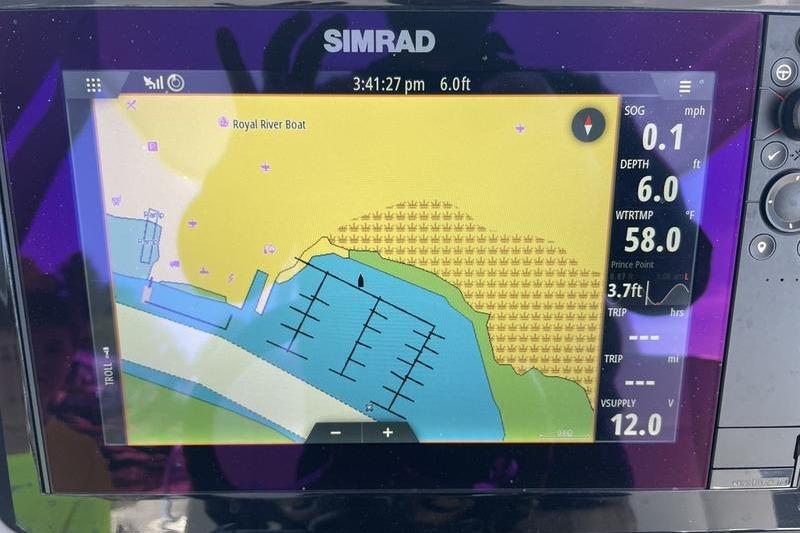 Simrad navigation display on 2023 Robalo R270 Center Console boat, showing map and data.
