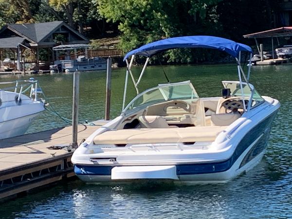 2000 Sea Ray 210 Bow Rider docked on a sunny day.