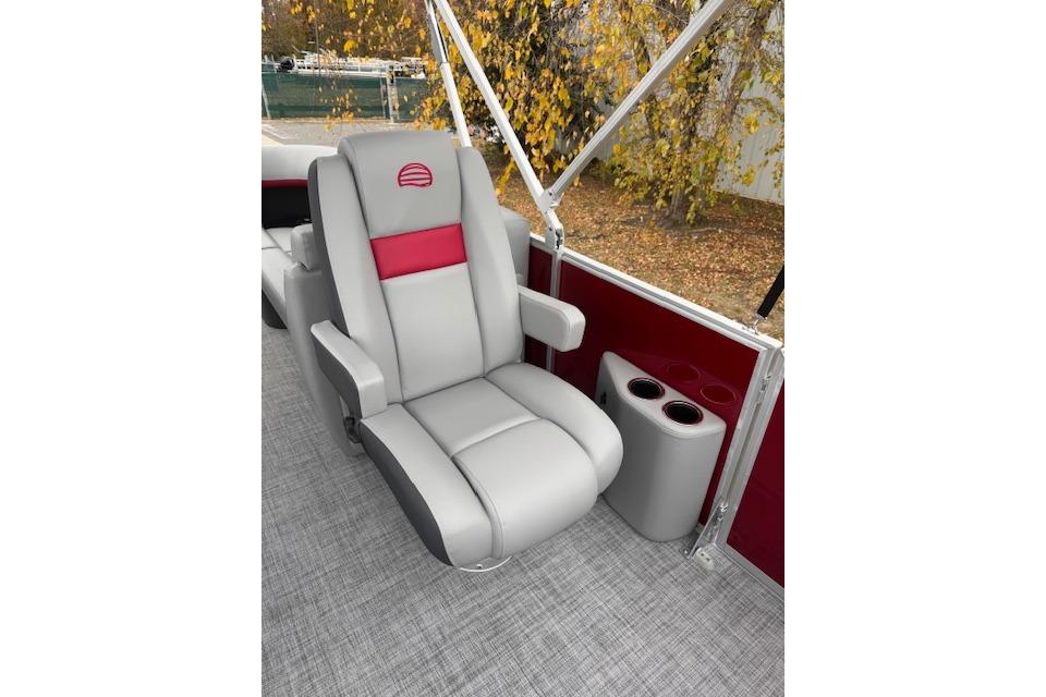 Luxurious seating on 2026 Sun Tracker Party Barge 22 DLX with cup holders and stylish design.