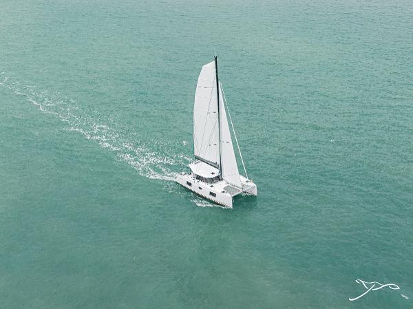 2025 Nautitech 40 Open catamaran sailing on calm turquoise waters.
