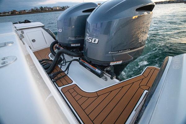 Manufacturer Provided Image: 2025 Southport 27 FE boat with twin Yamaha outboard engines on teak deck.