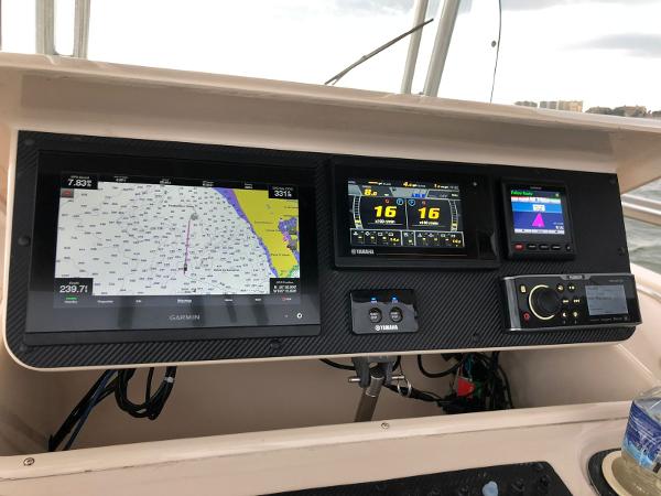2006 Grady-White Bimini 306 dashboard with navigation and control systems.