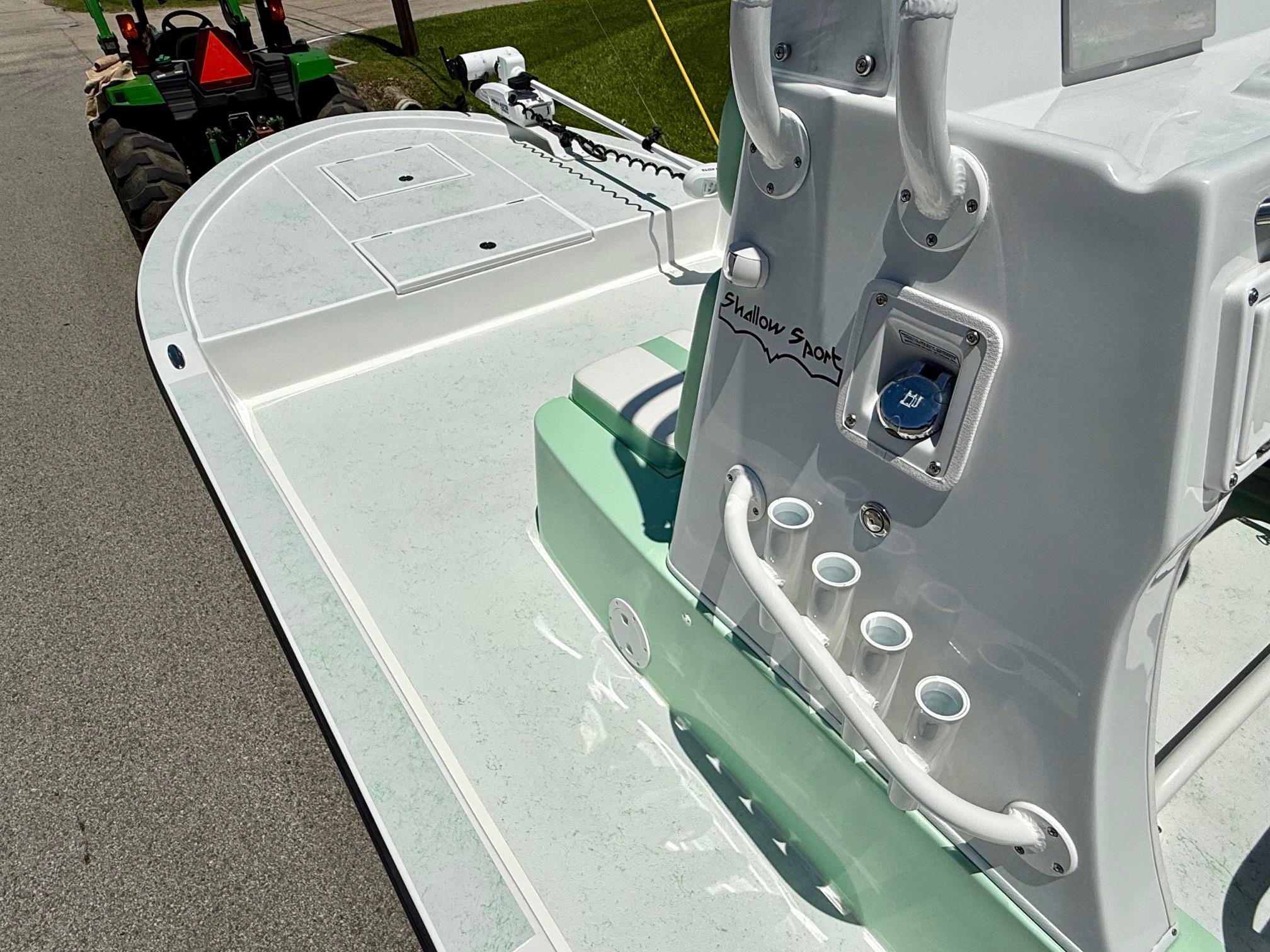 2023 Shallow Sport 24 Sport boat, featuring sleek design and modern controls.