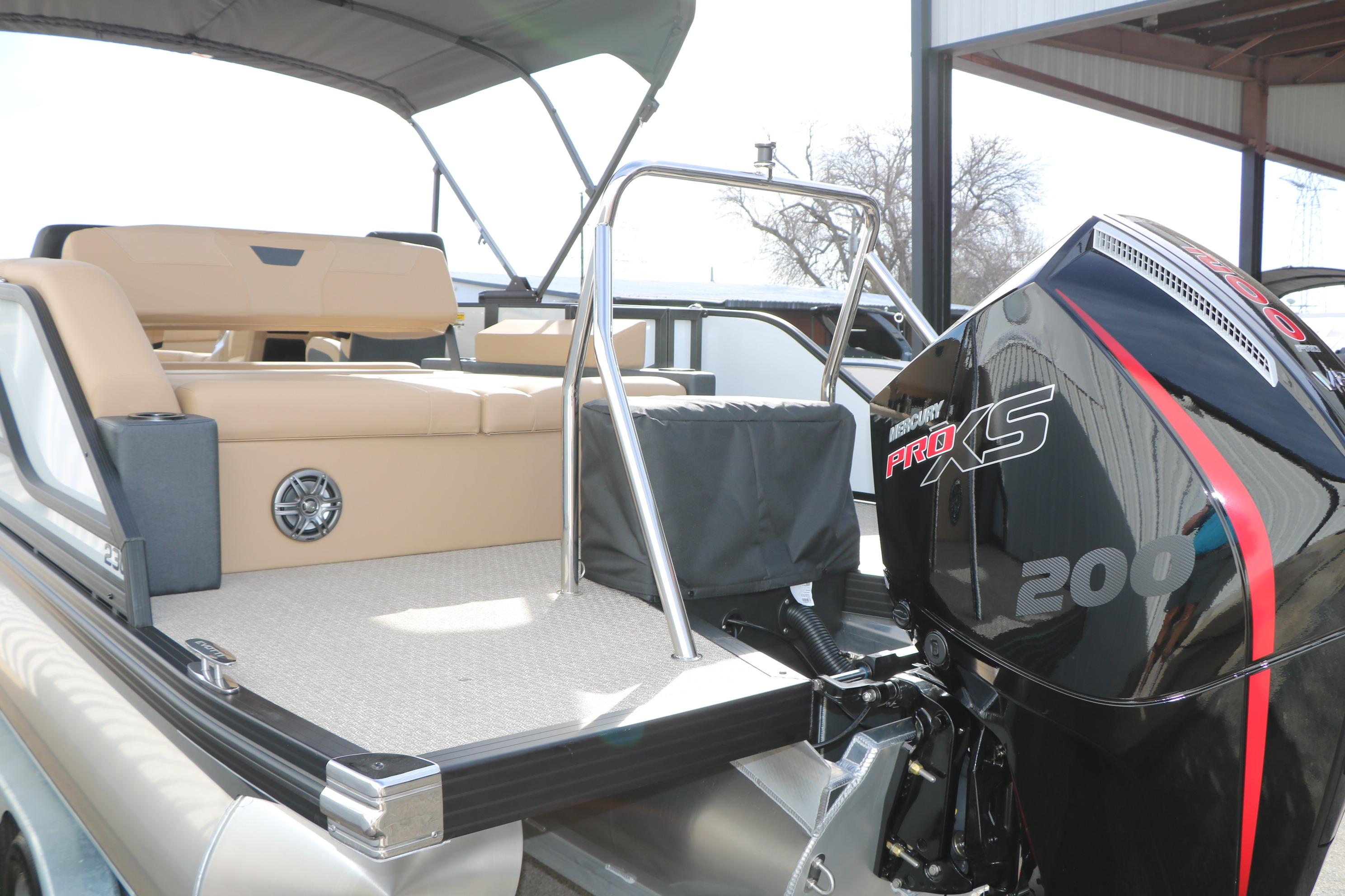 2026 Evotti 523CS boat with Mercury Pro XS 200 engine, beige seating, and canopy.