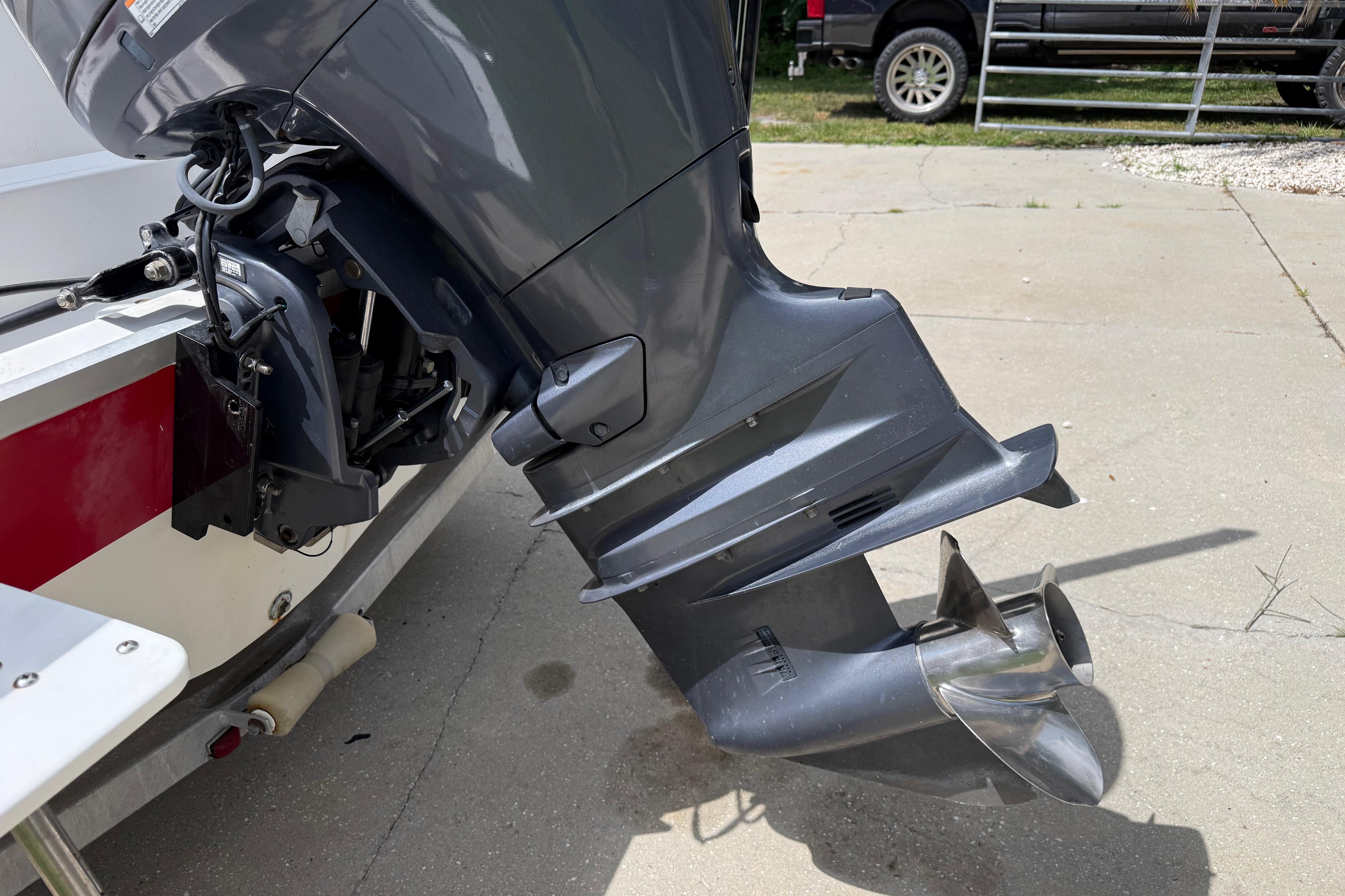 Outboard motor of a 2012 Clearwater 2000 Center Console boat on a trailer.
