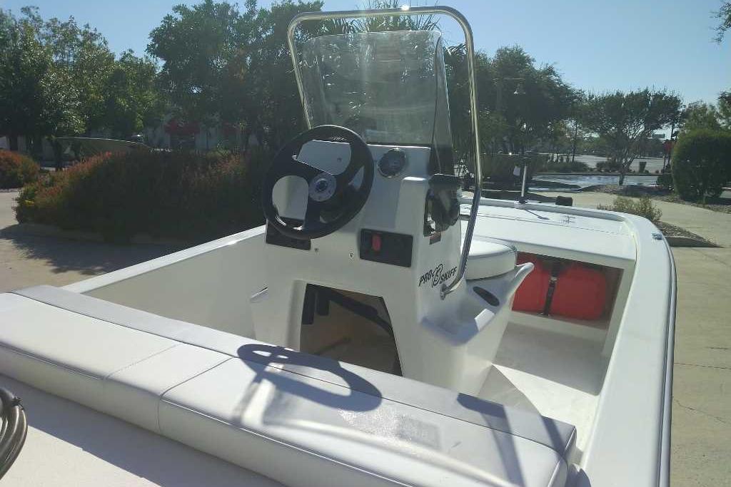 2026 Mako Pro Skiff 13 CC boat with center console and steering wheel.