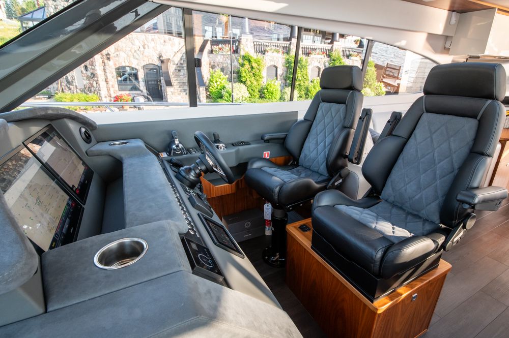 Interior of 2022 Riviera 6000 Sport Yacht Platinum with luxurious seating and modern controls.