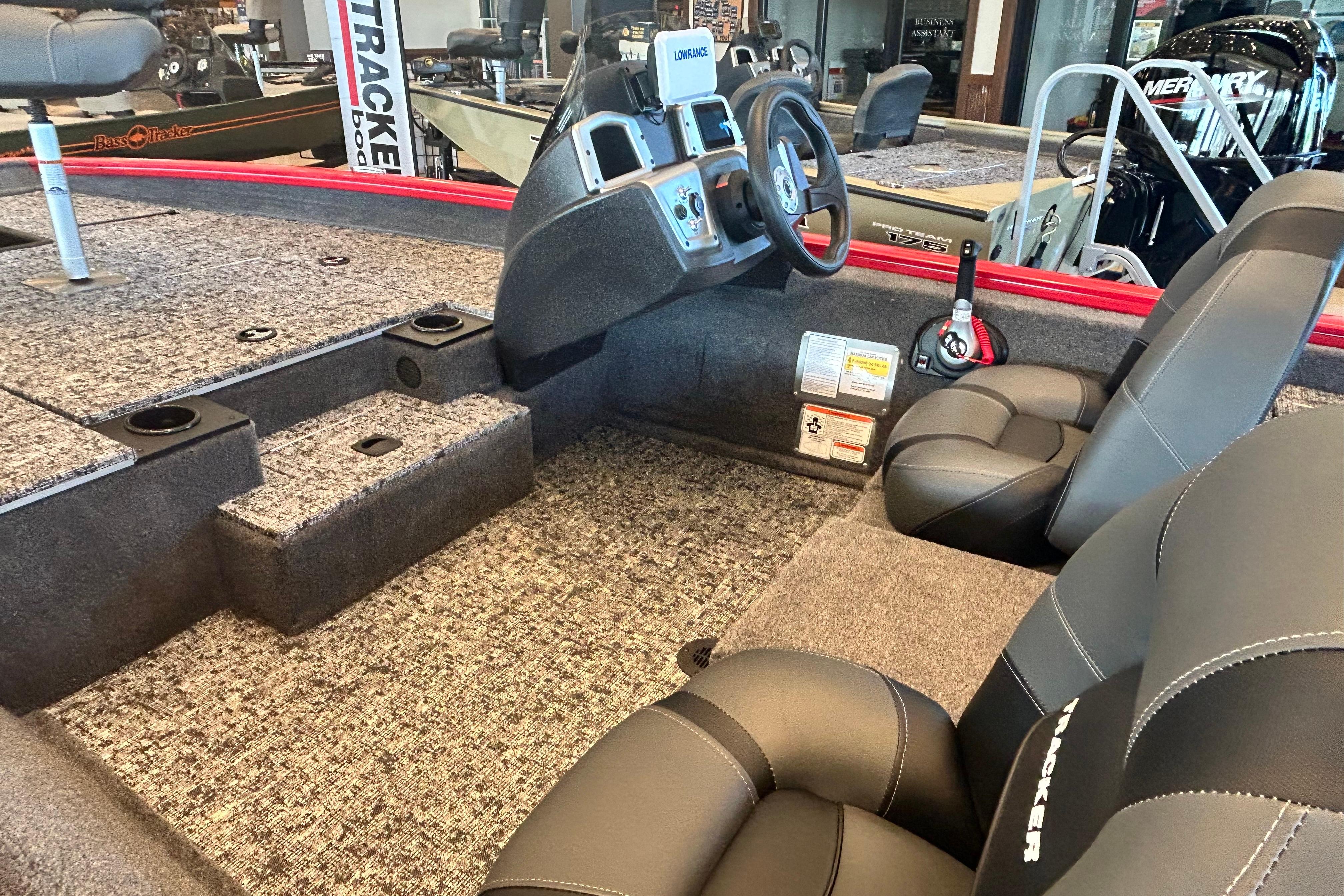 2026 Tracker Pro Team 175 boat interior with steering console and seating.