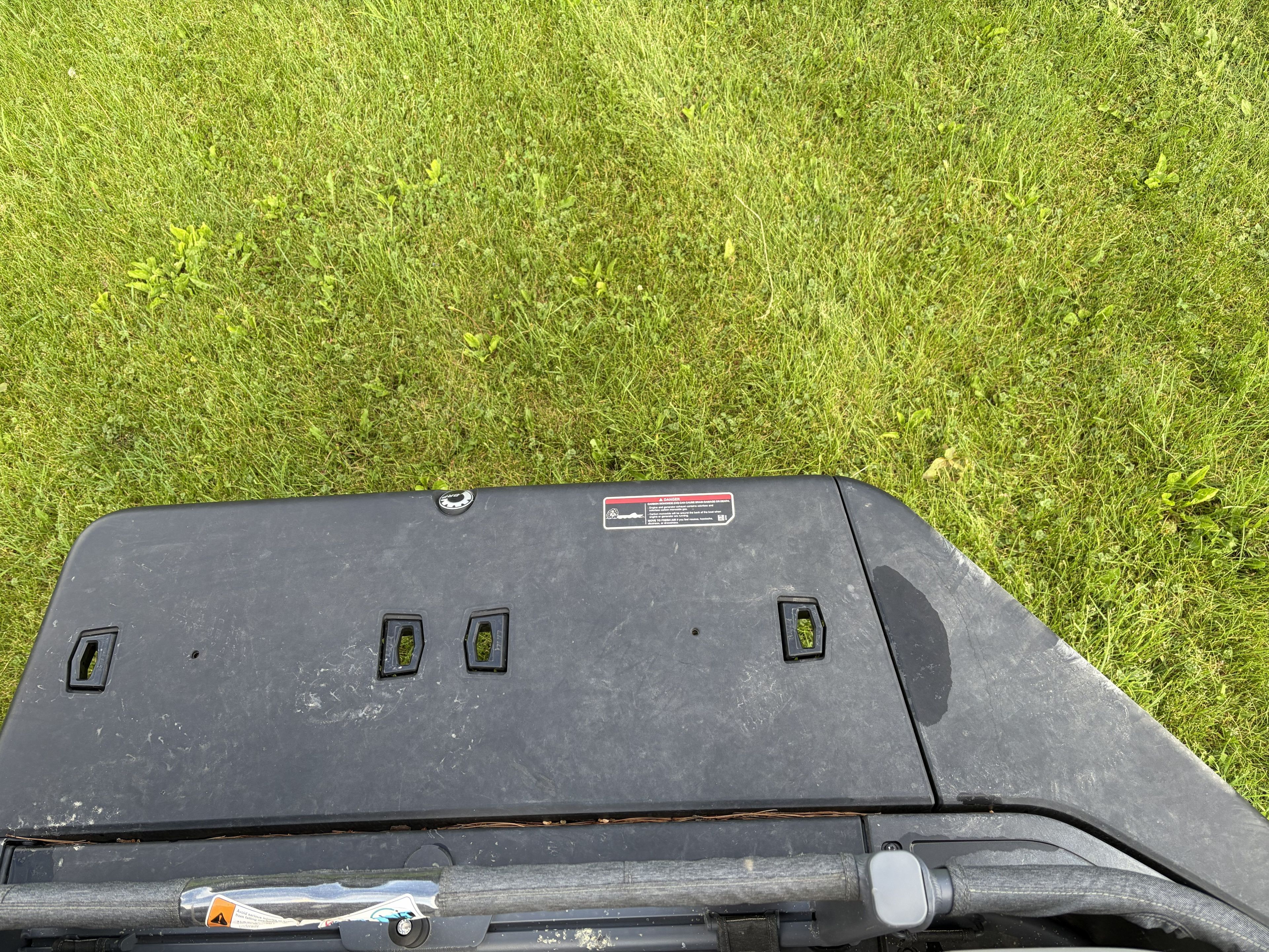 A part of a 2023 Sea Doo Switch on grass.