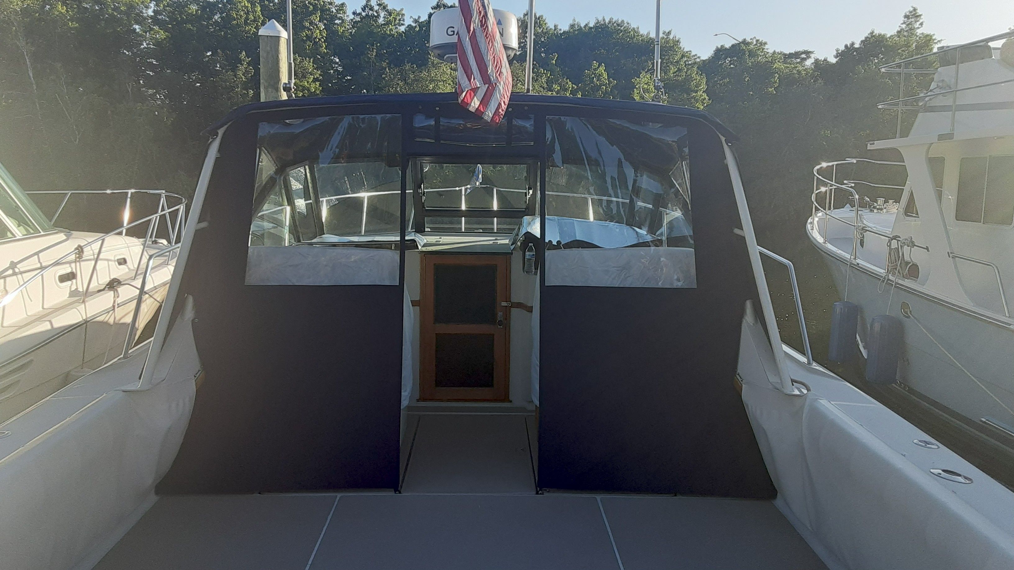 1985 Tiara Yachts 3100 Open at dock, rear view.