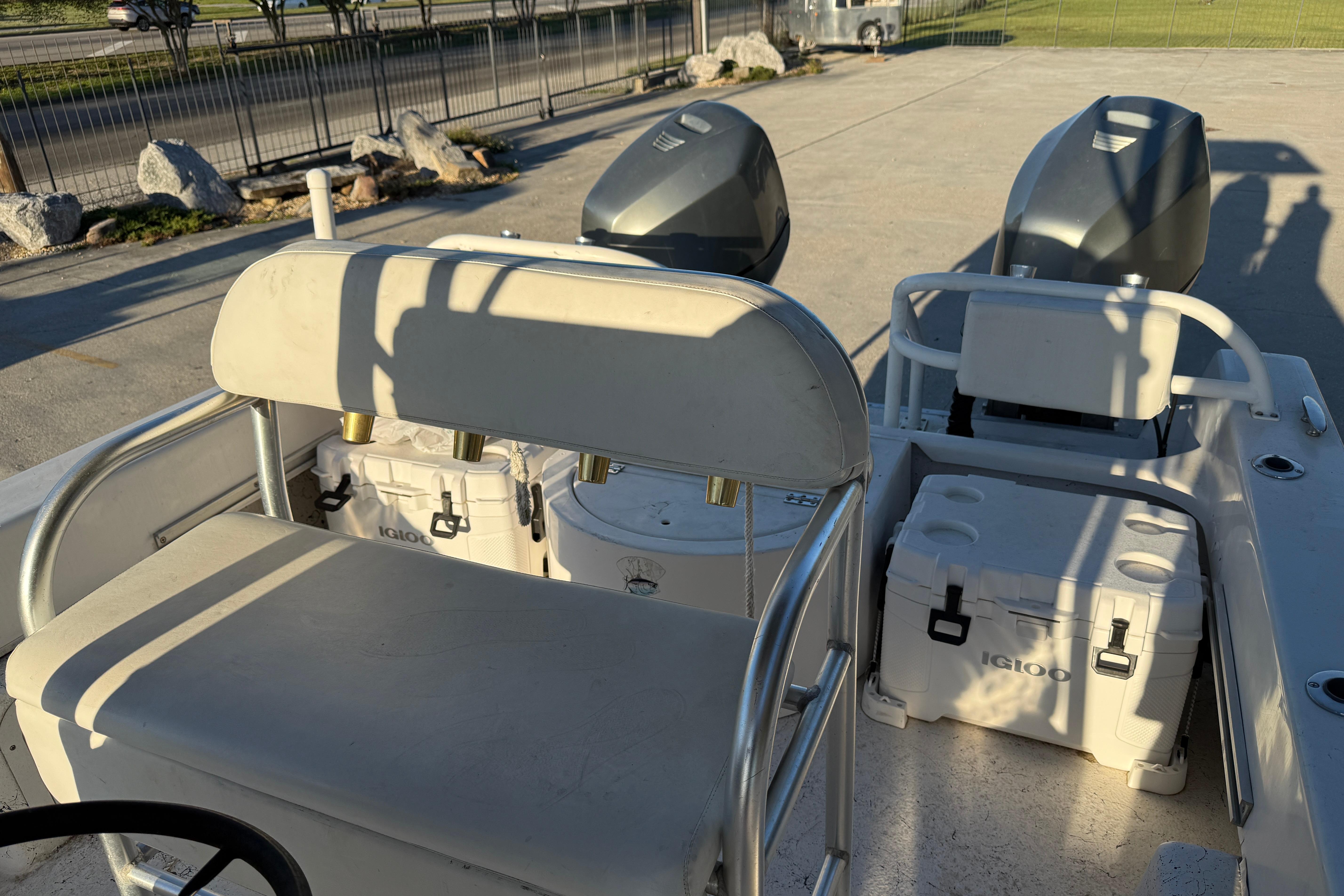 2007 Twin Vee 26 Center Console boat interior with seating and dual engines.
