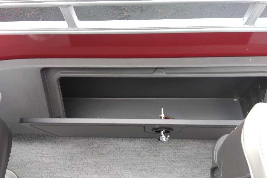 Storage compartment on a 2026 Sun Tracker Fishin' Barge 22 DLX pontoon boat.