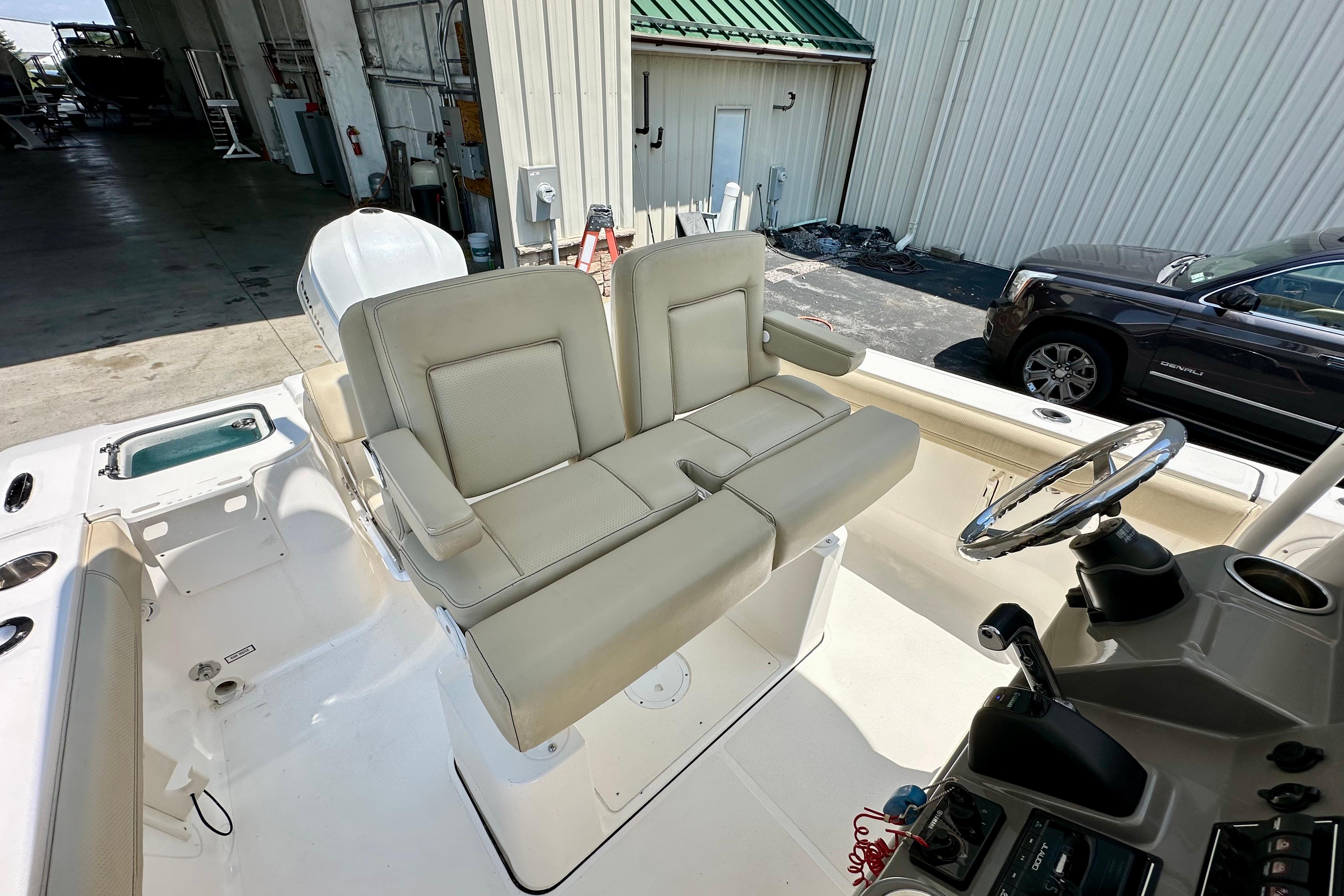 2020 Pursuit C 238 Center Console boat interior with dual seating and steering wheel.