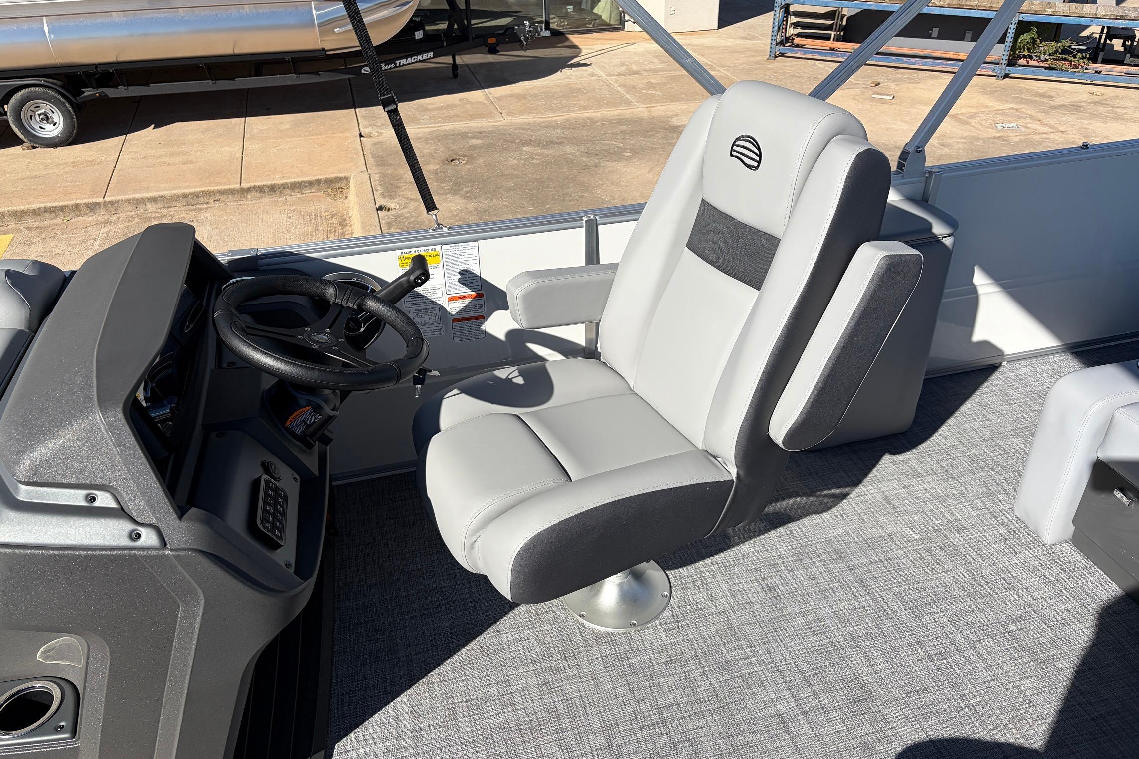 Captain's chair and helm of 2026 Sun Tracker Party Barge 22 RF XP3 pontoon boat.