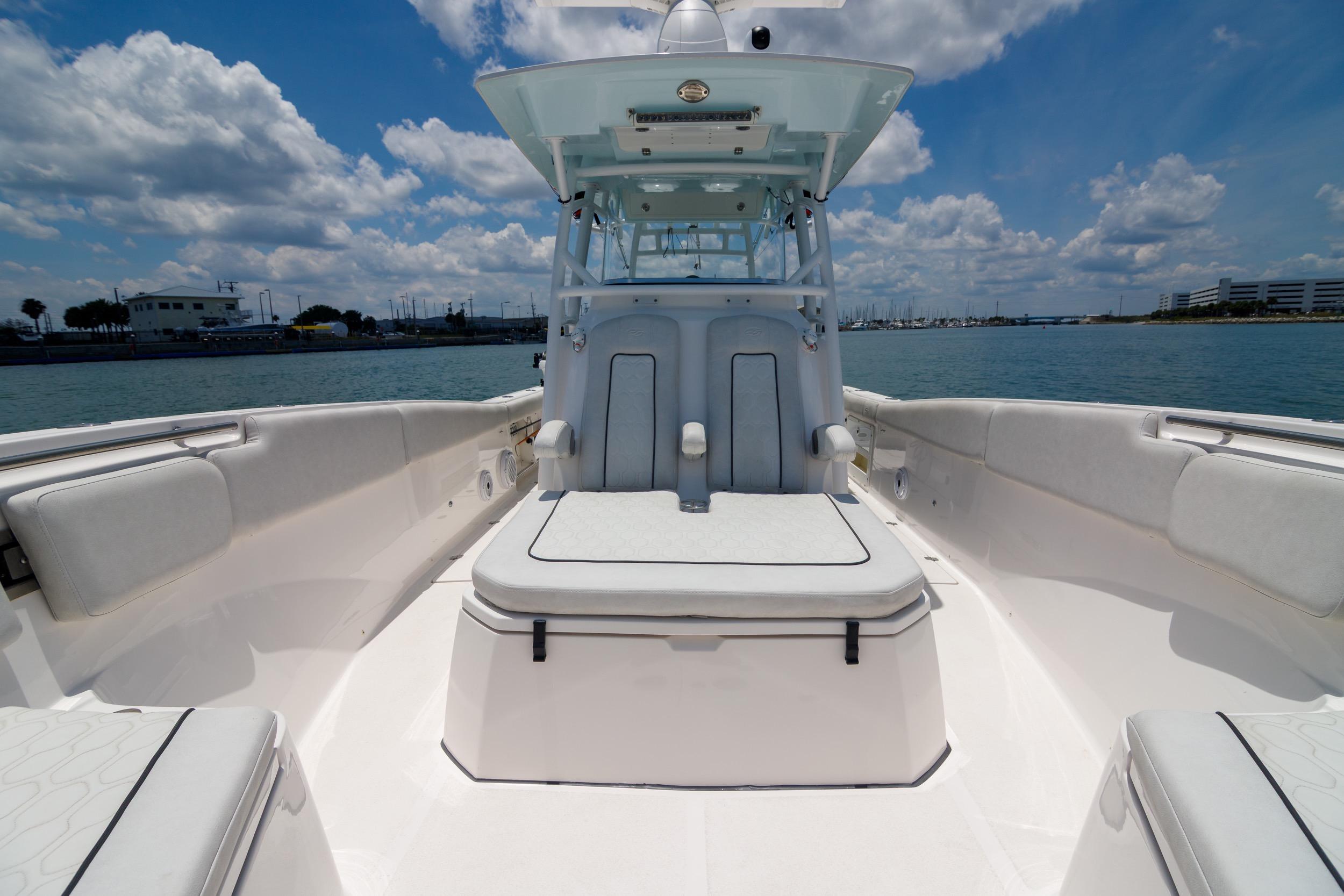2021 Sea Fox 328 Commander boat interior with seating, under a blue sky.