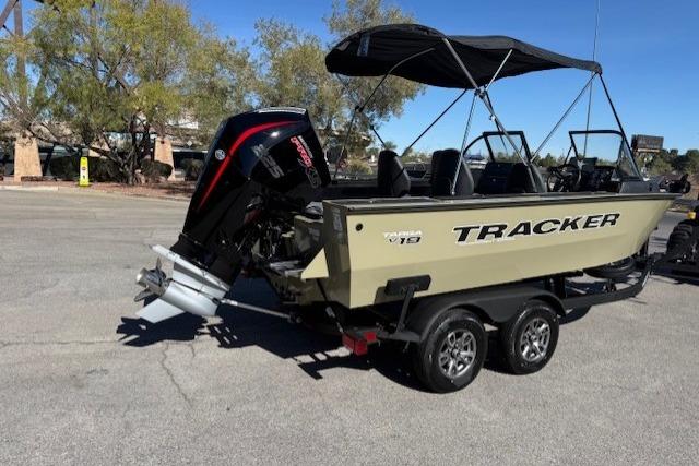 2026 Tracker Targa V-19 WT boat with canopy and outboard motor on trailer.