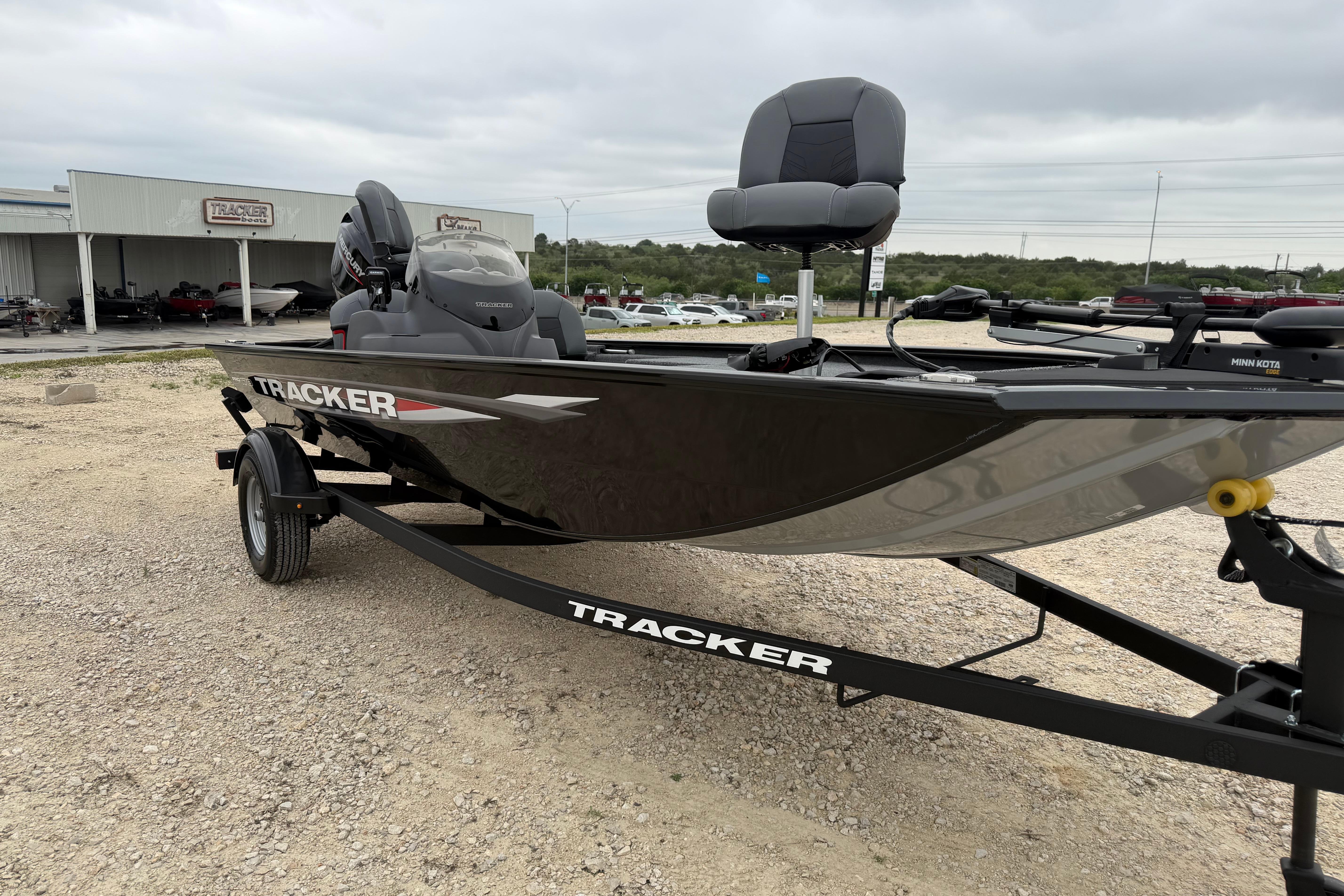 2026 Tracker Pro 170 boat on trailer, displayed outdoors near dealership.