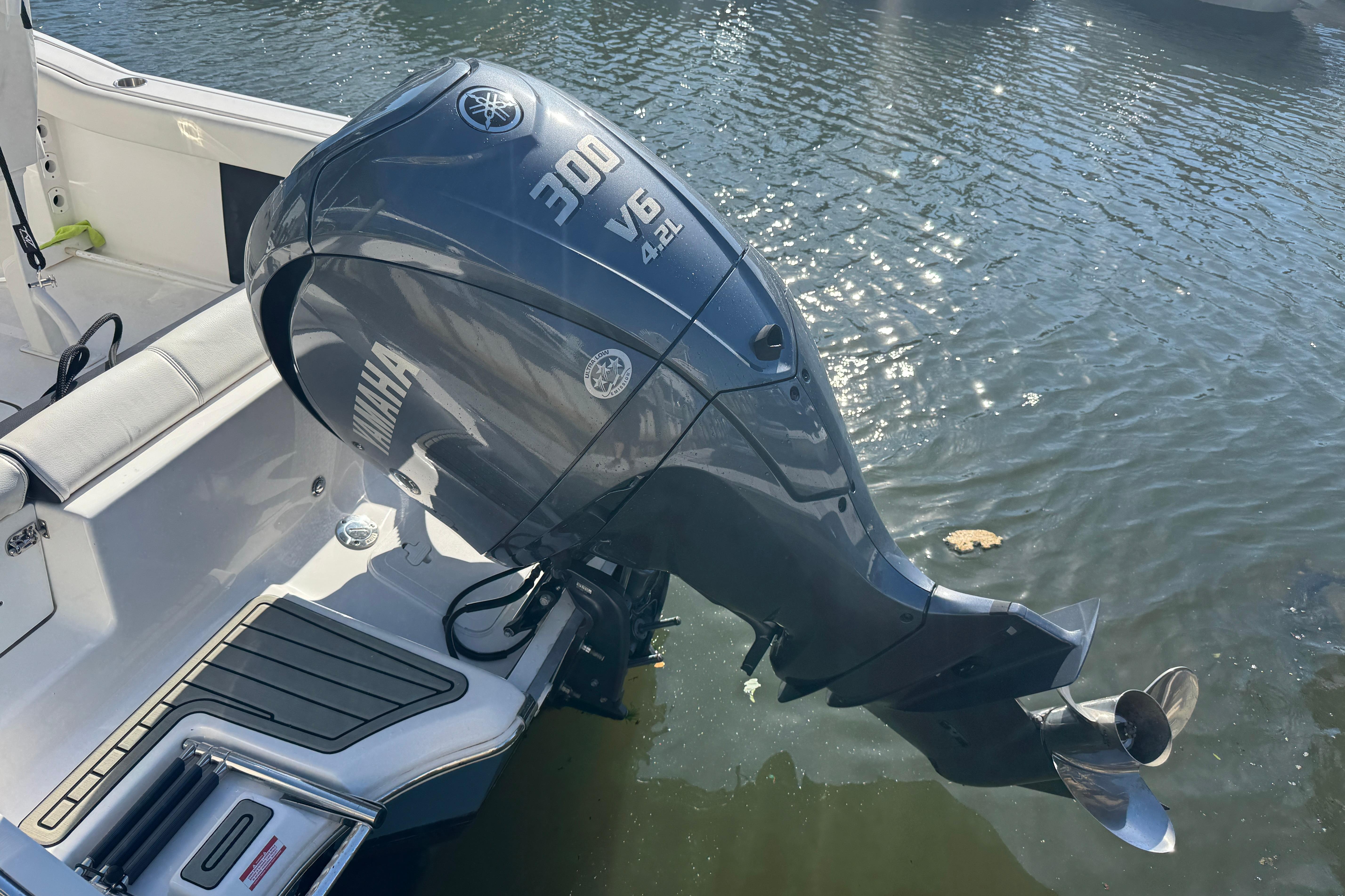 2025 Tidewater 232 LXF boat with Yamaha 300 V6 outboard engine on water.