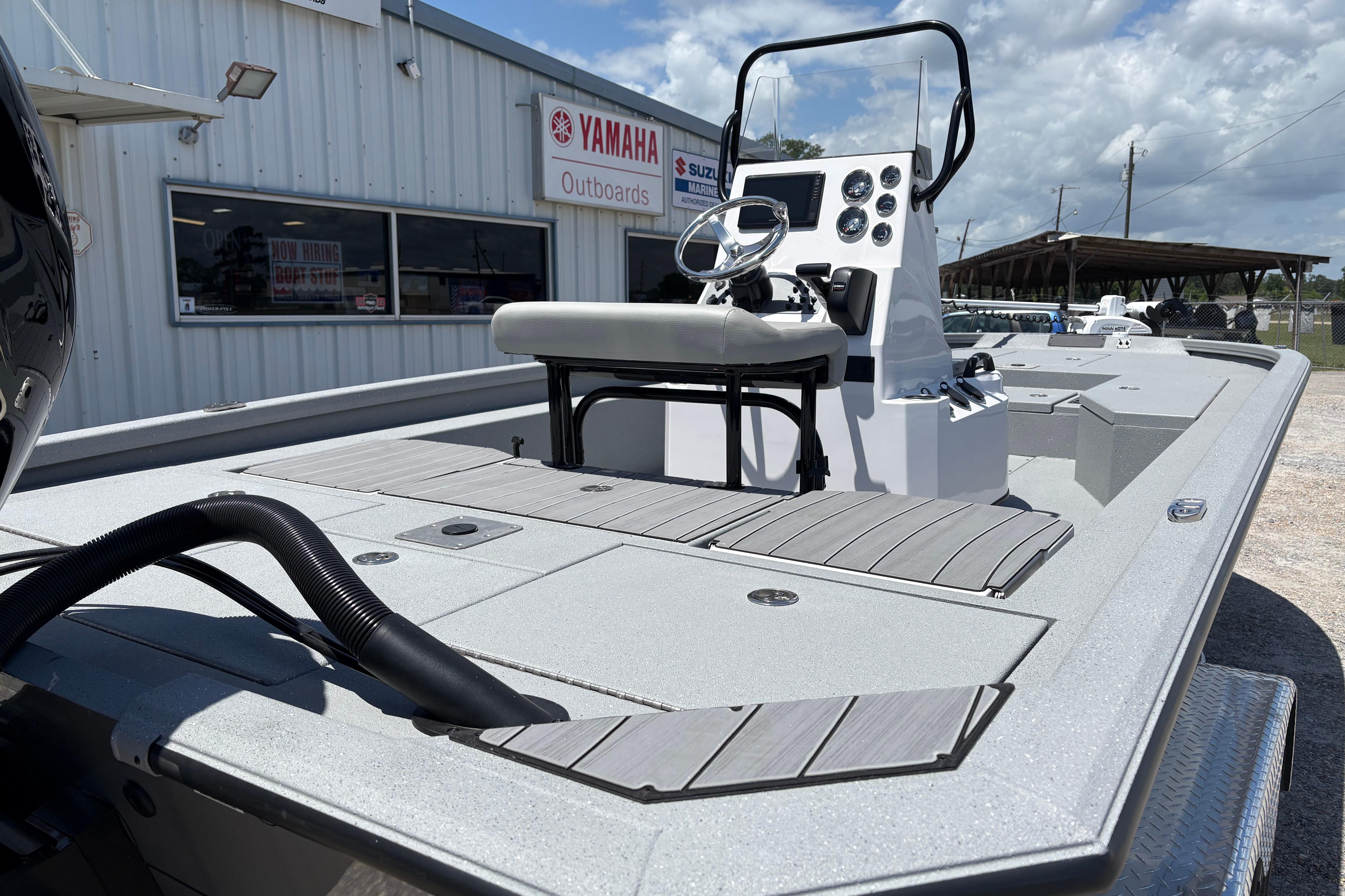 2026 Vexus ACX 2150 boat with modern console, displayed at Yamaha Outboards dealership.