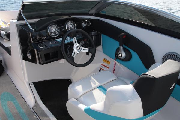 Manufacturer Provided Image: 2016 Four Winns H200RS boat cockpit with steering wheel and control panel.