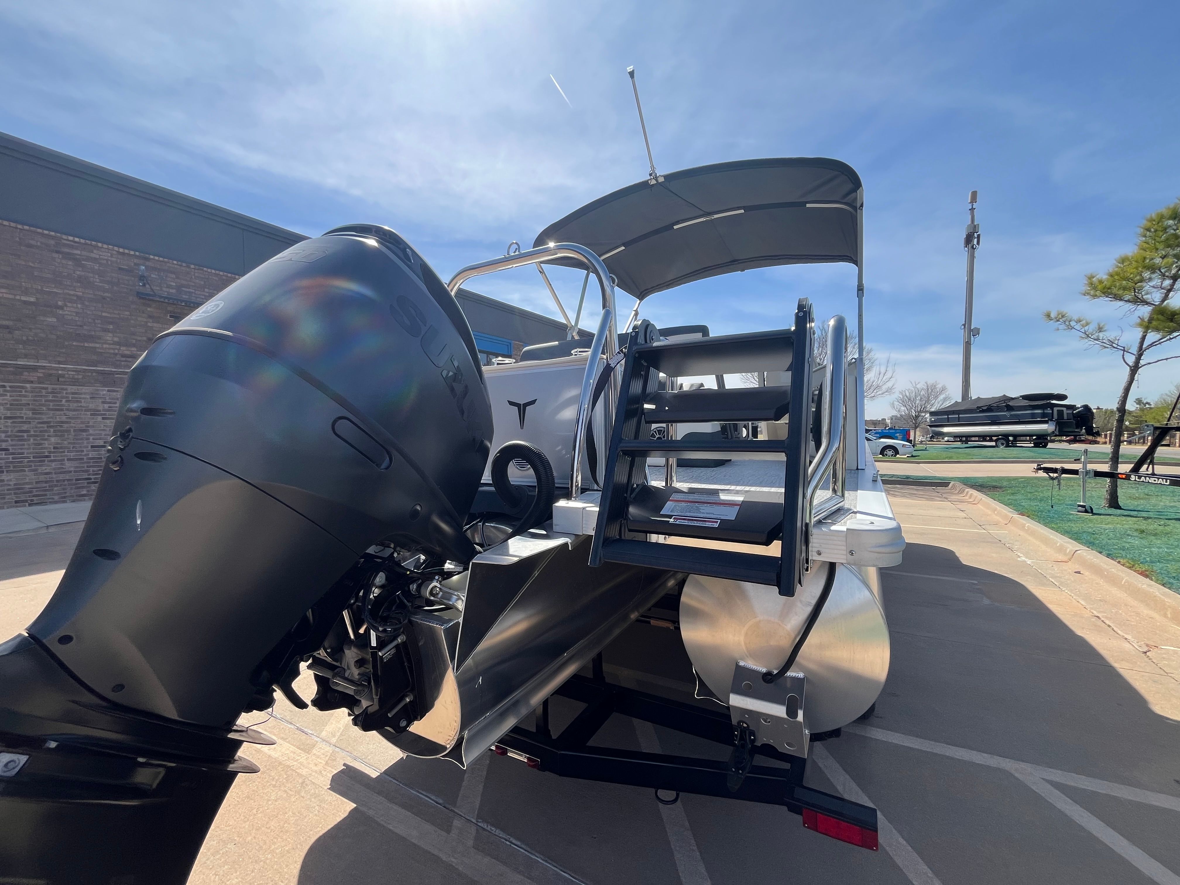 2026 Tahoe 2385 LTZ Cruise with outboard motor and rear bench.
