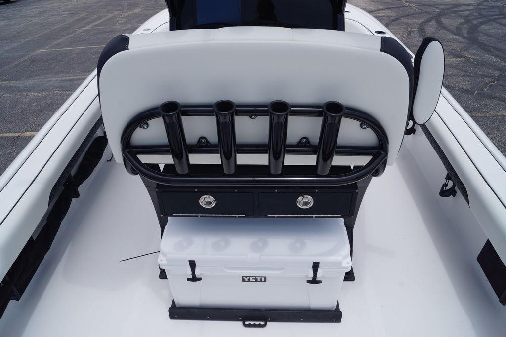 2027 Tidewater 2500 Carolina Bay boat interior with rod holders and Yeti cooler.