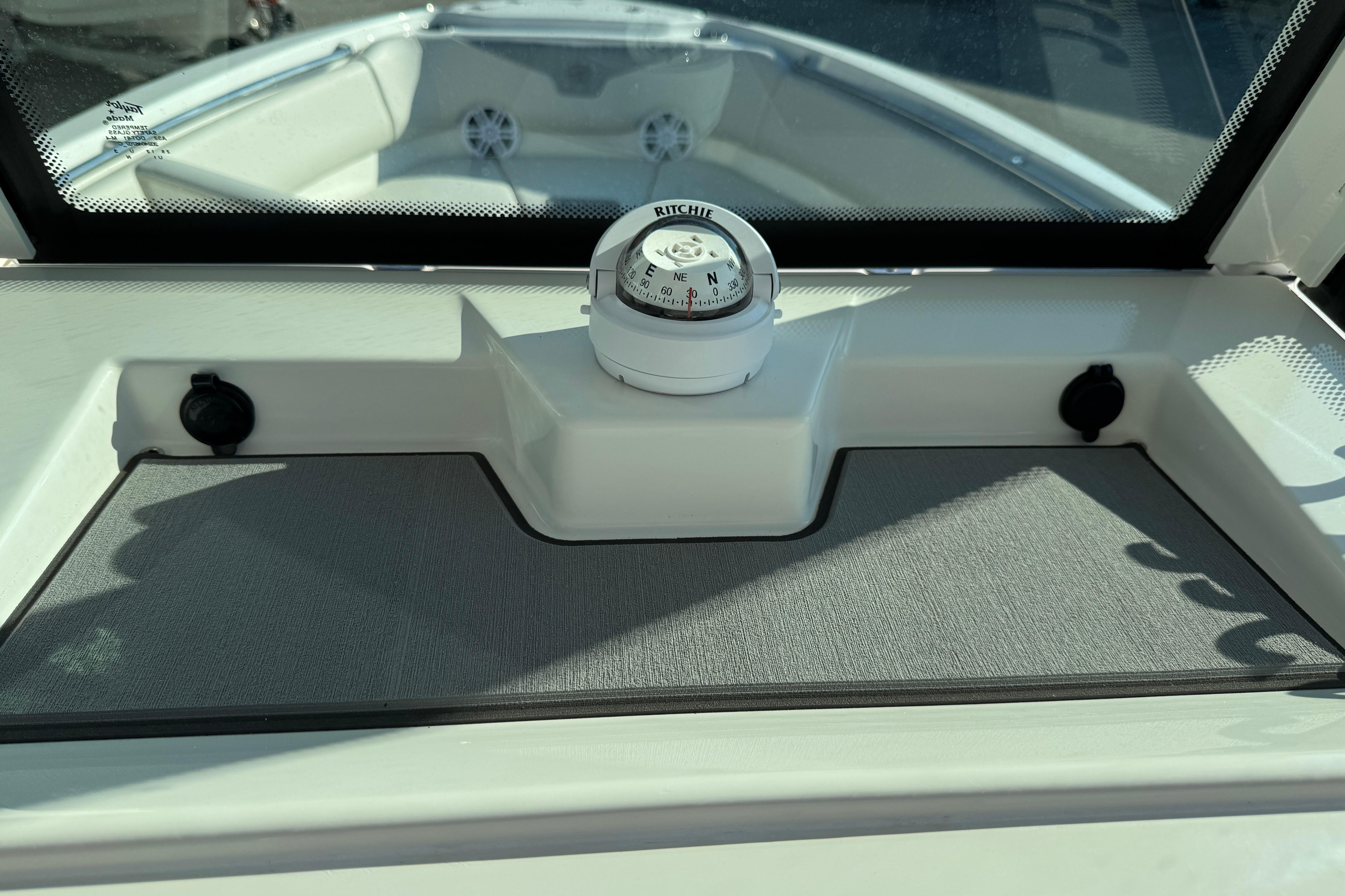 Compass on 2026 Sailfish 232 CC boat dashboard, featuring sleek design and functionality.