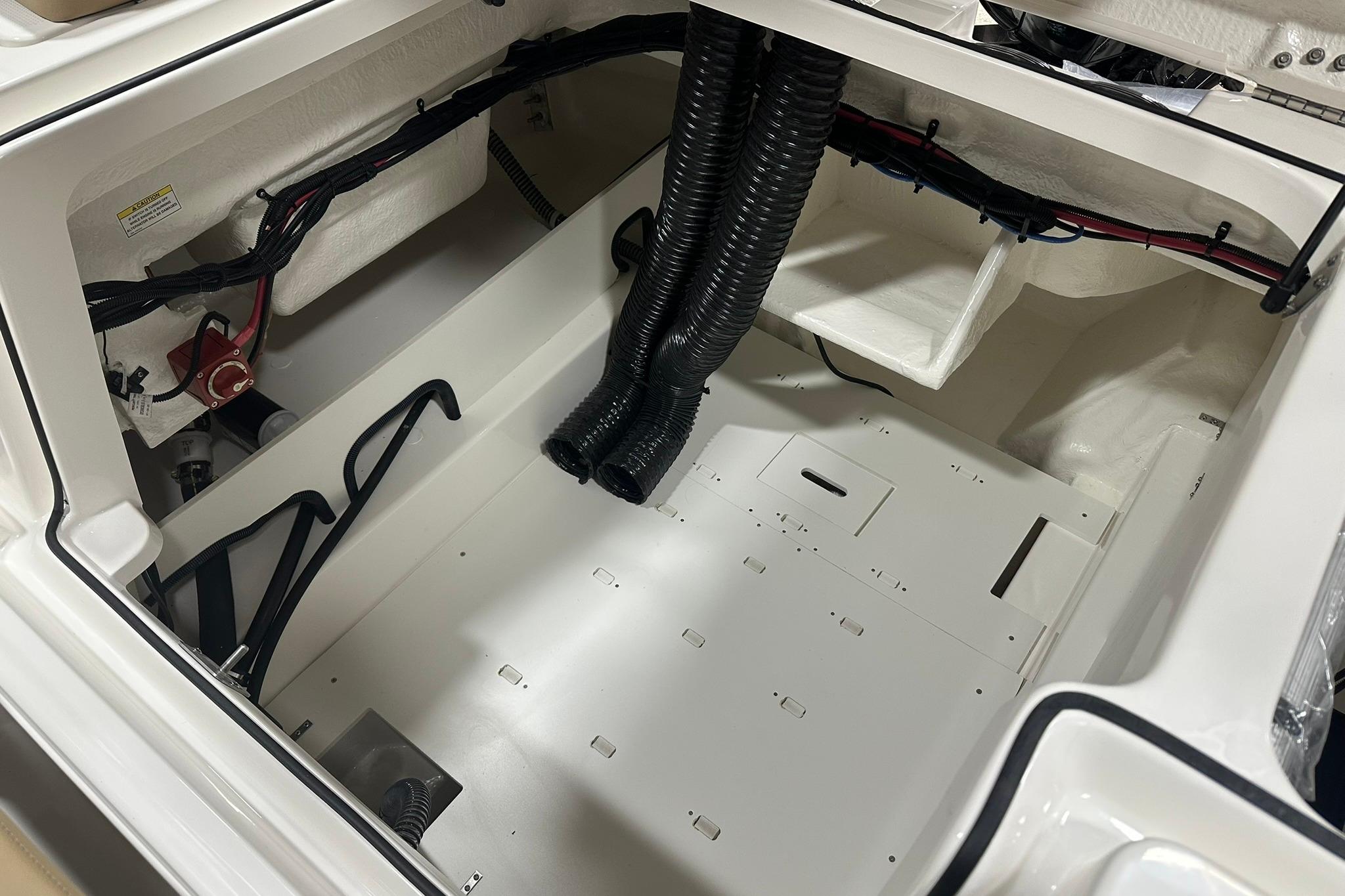 2026 Bayliner VR6 Bowrider OB engine compartment, showcasing wiring and ventilation.