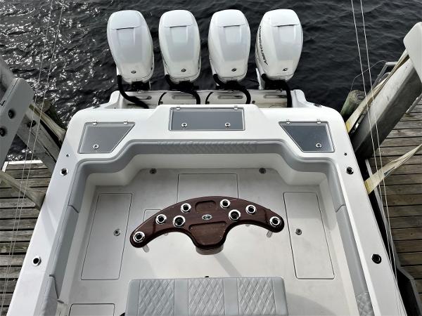 2020 Front Runner 39 Center Console boat with four engines, docked by the water.
