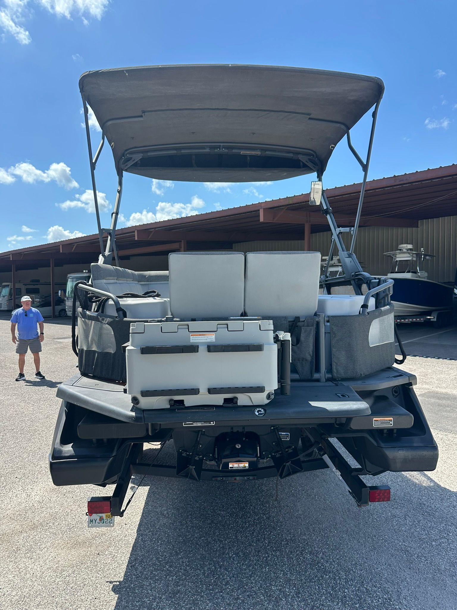 The image shows a 2023 Sea-Doo 21 SWITCH SPORT boat on a trailer.
