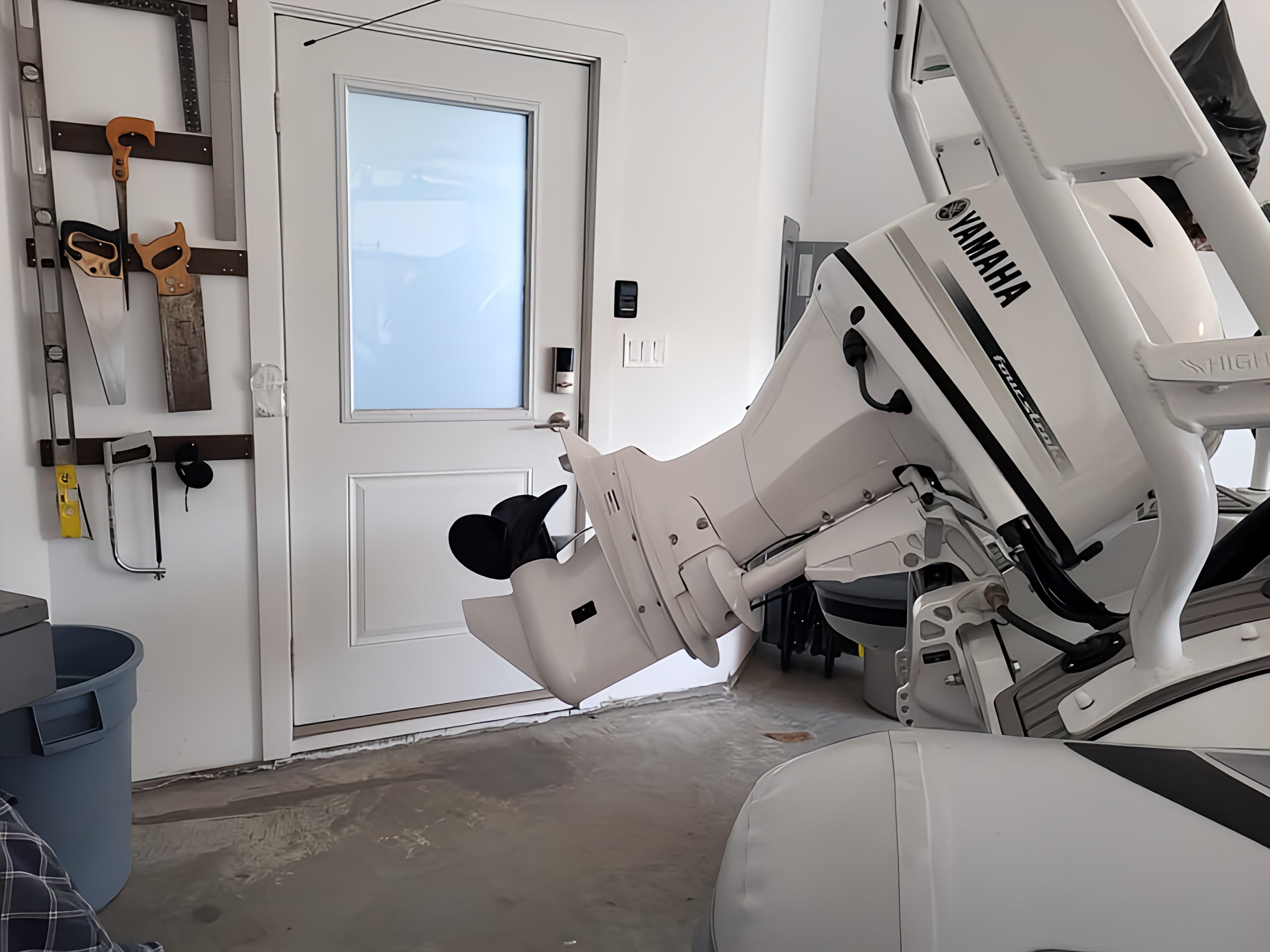 2023 Highfield Sport 420 with Yamaha engine in a garage, tools on wall.