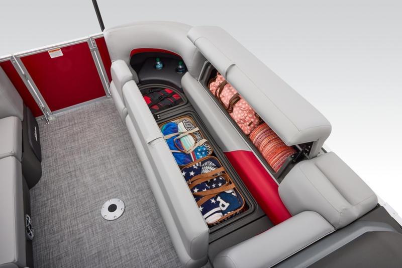2026 Sun Tracker Party Barge 22 DLX interior storage with organized compartments and seating.