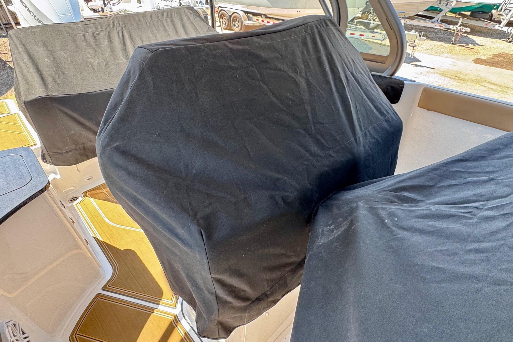 Covered seats on a 2026 Monterey Elite 27 OB boat deck.