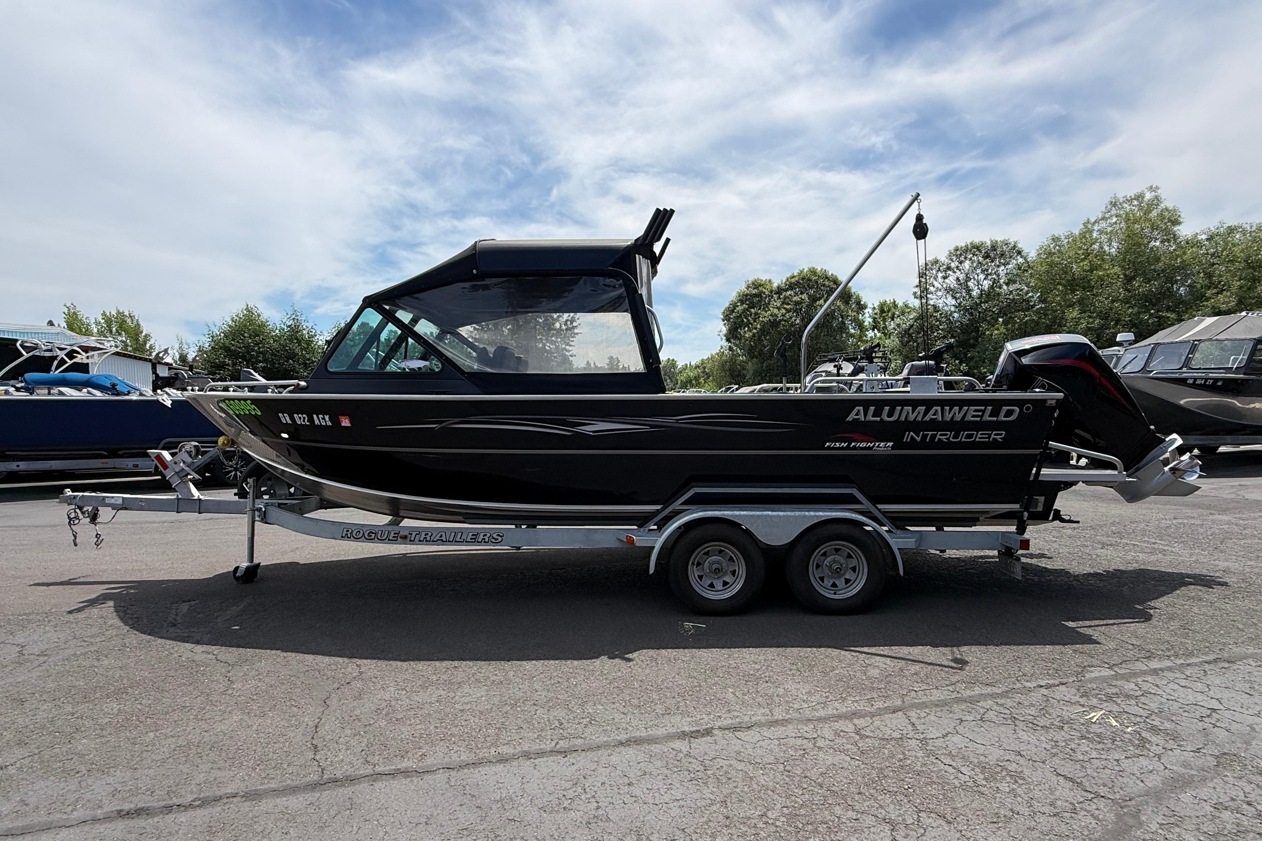2019 Alumaweld Intruder Hard Top 22' boat on trailer, parked outdoors.