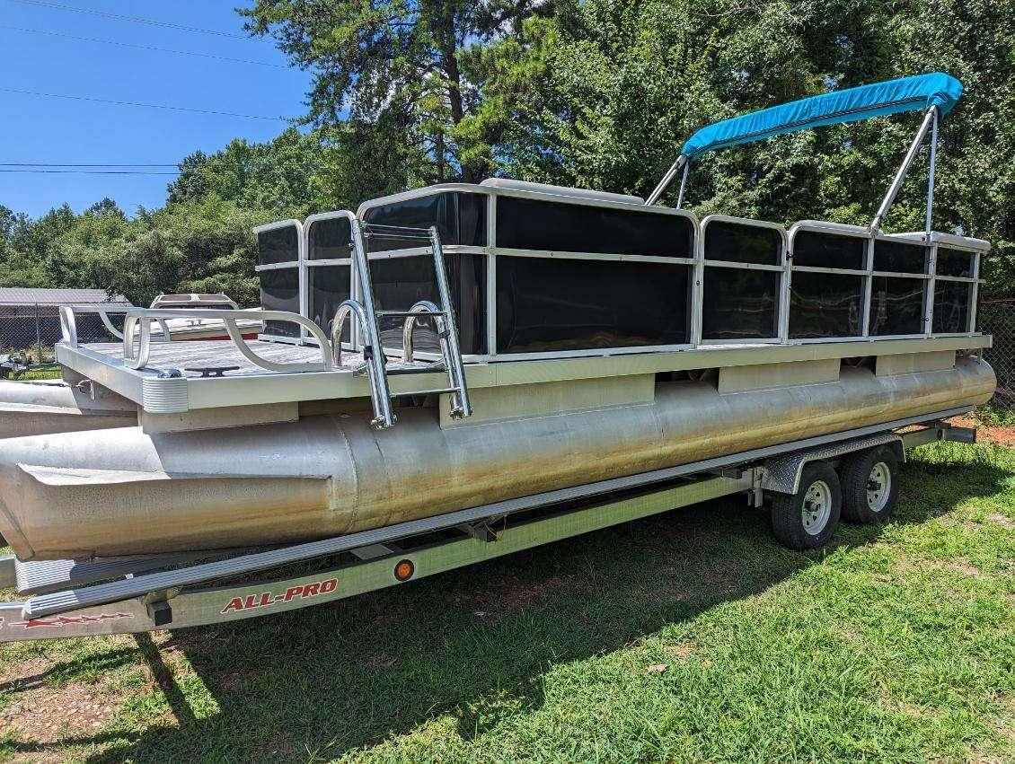 2022 Crest Pontoon boat parked on trailer outdoors.