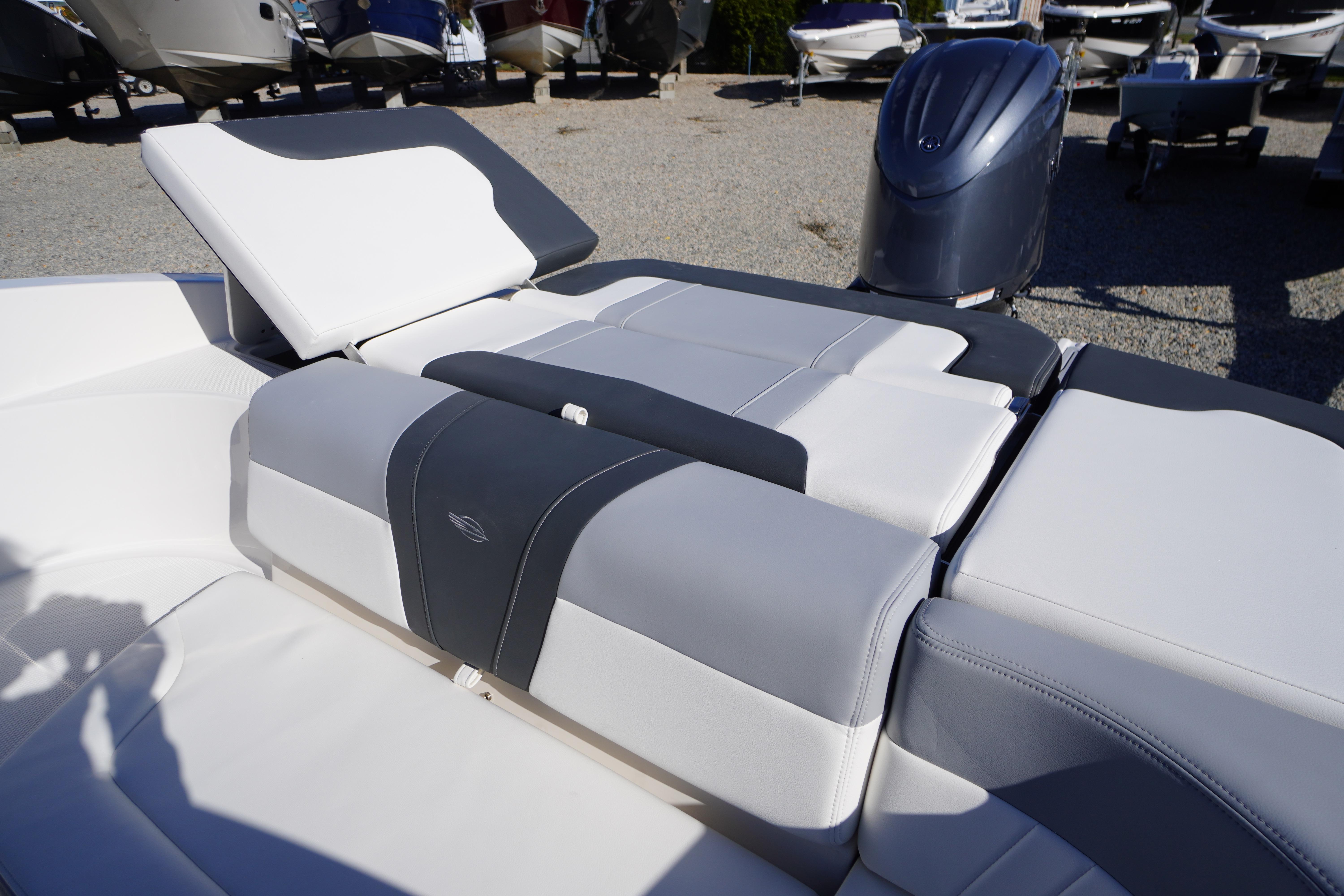 2026 Chaparral 23 SSi OB boat interior with adjustable seating and outboard motor.