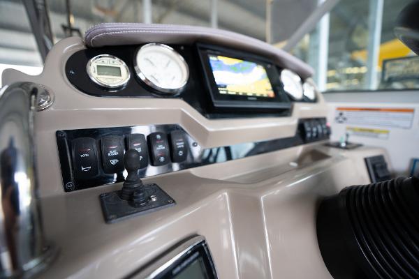 2016 Regal 28 Express boat dashboard with gauges and navigation display.