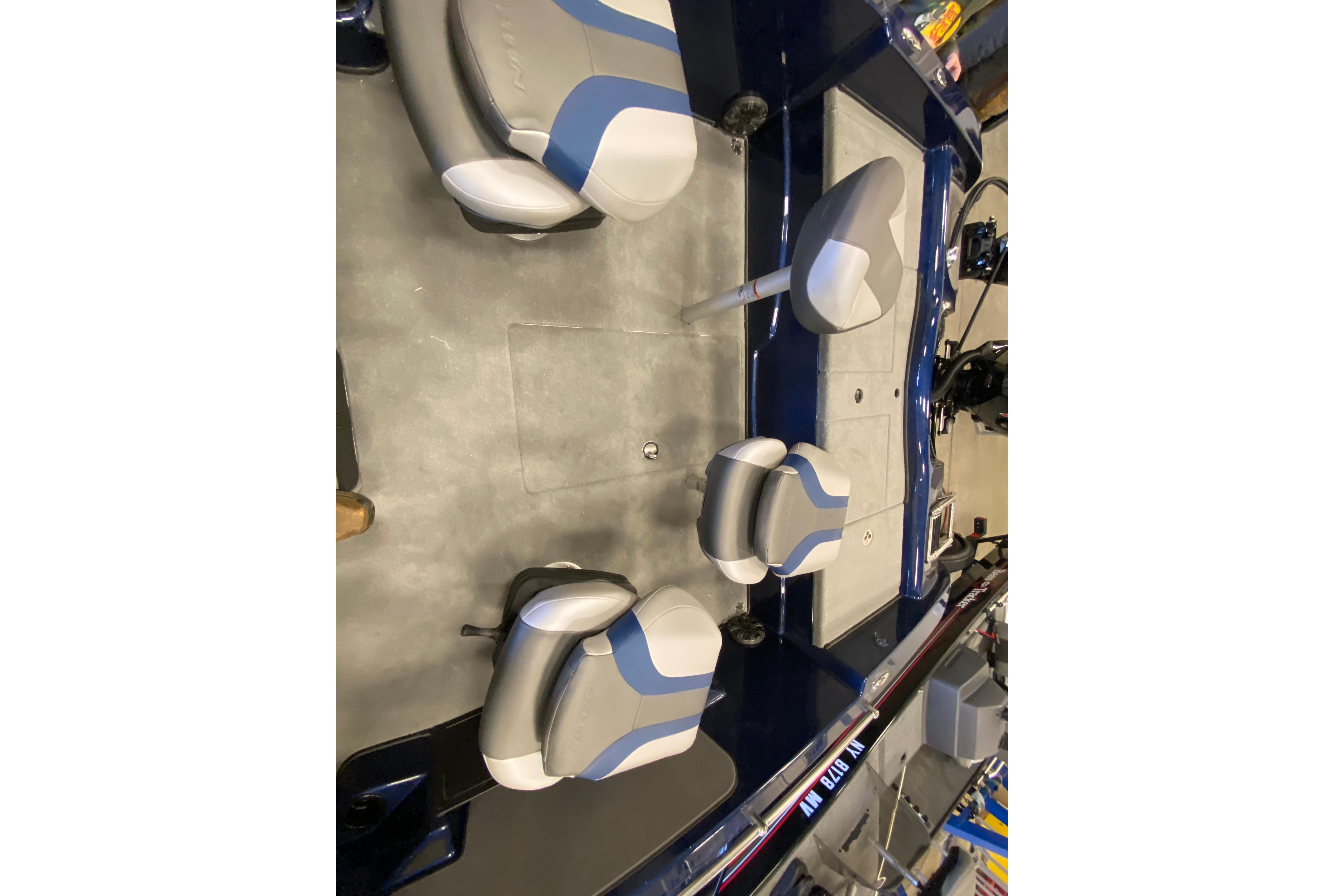 Interior view of 2026 Nitro ZV19 Pro boat with gray and blue seating.